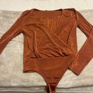 Boutique orange body suit